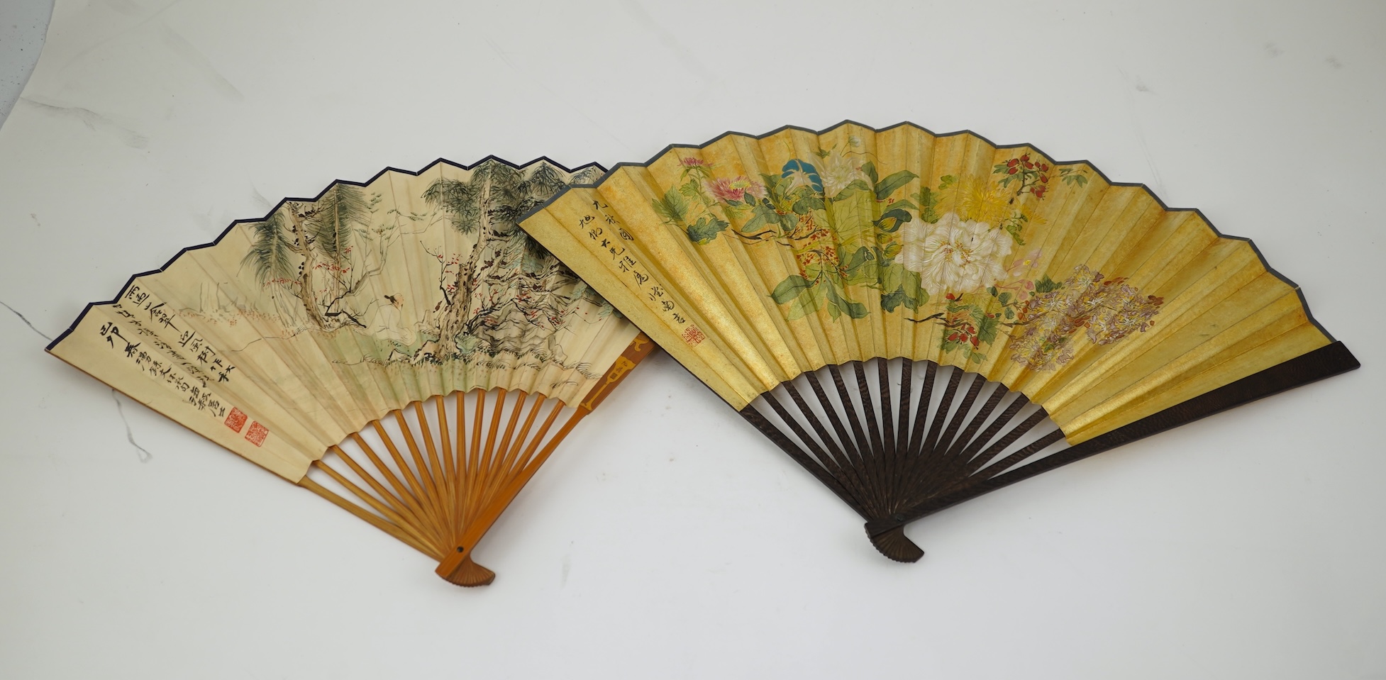 Two Chinese inscribed paper leaf fans, late 19th century